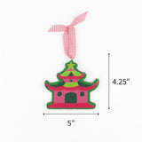 Pink and green felt chinoiserie pagoda Christmas ornament with gingham ribbon, measuring 4.25" by 5"