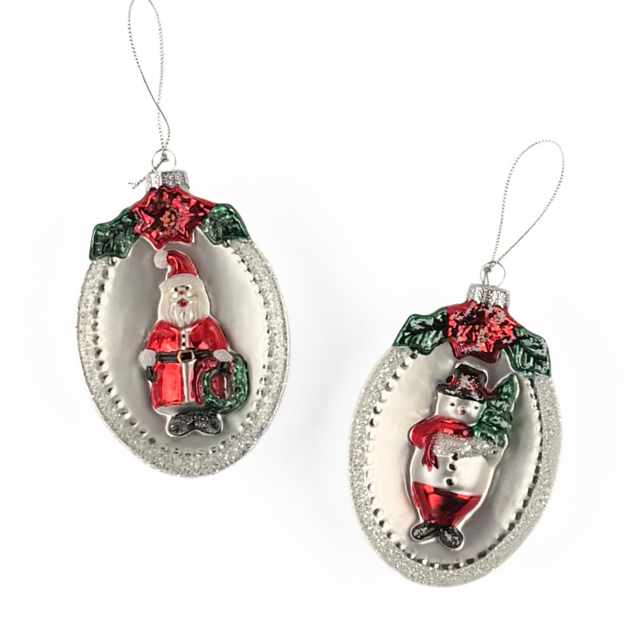 Festive glass Christmas ornaments featuring Santa and snowman designs with sparkling silver, red, and green accents.