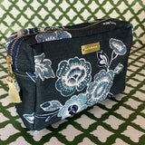 Front 3/4 view of Temple Garden medium sized toiletry bag in navy blue features light blue floral motif.