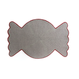 reverse/back of A Christmas rug in the shape of a wrapped red, white and pink candy. 