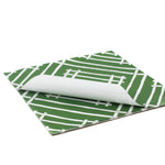 White and green paper placemats featuring a white bamboo pattern called Island House by Madcap Cottage