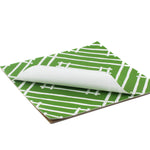 Island House square mid green paper placemats in a white background