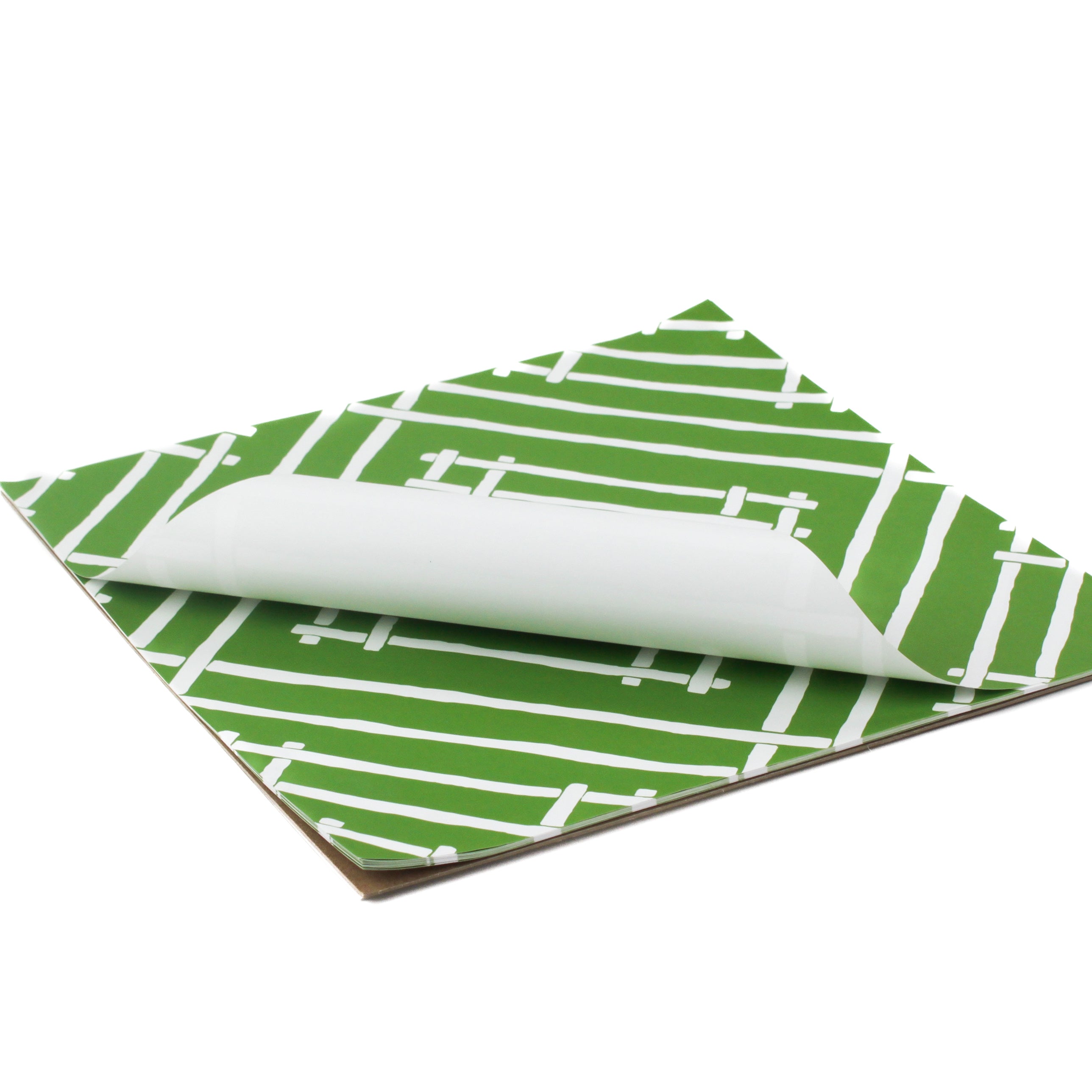 Island House square mid green paper placemats in a white background