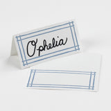 Bamboo Trellis Paper Place Cards in pool blue with elegant hand-written name, displayed on a white background