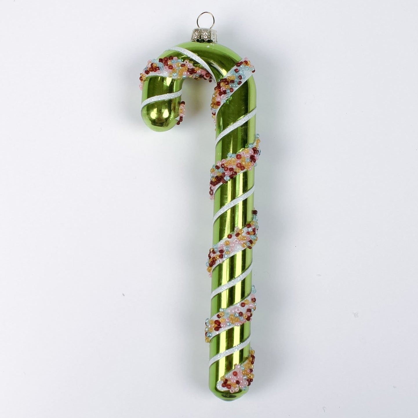 green glass candy cane ornaments on a white background