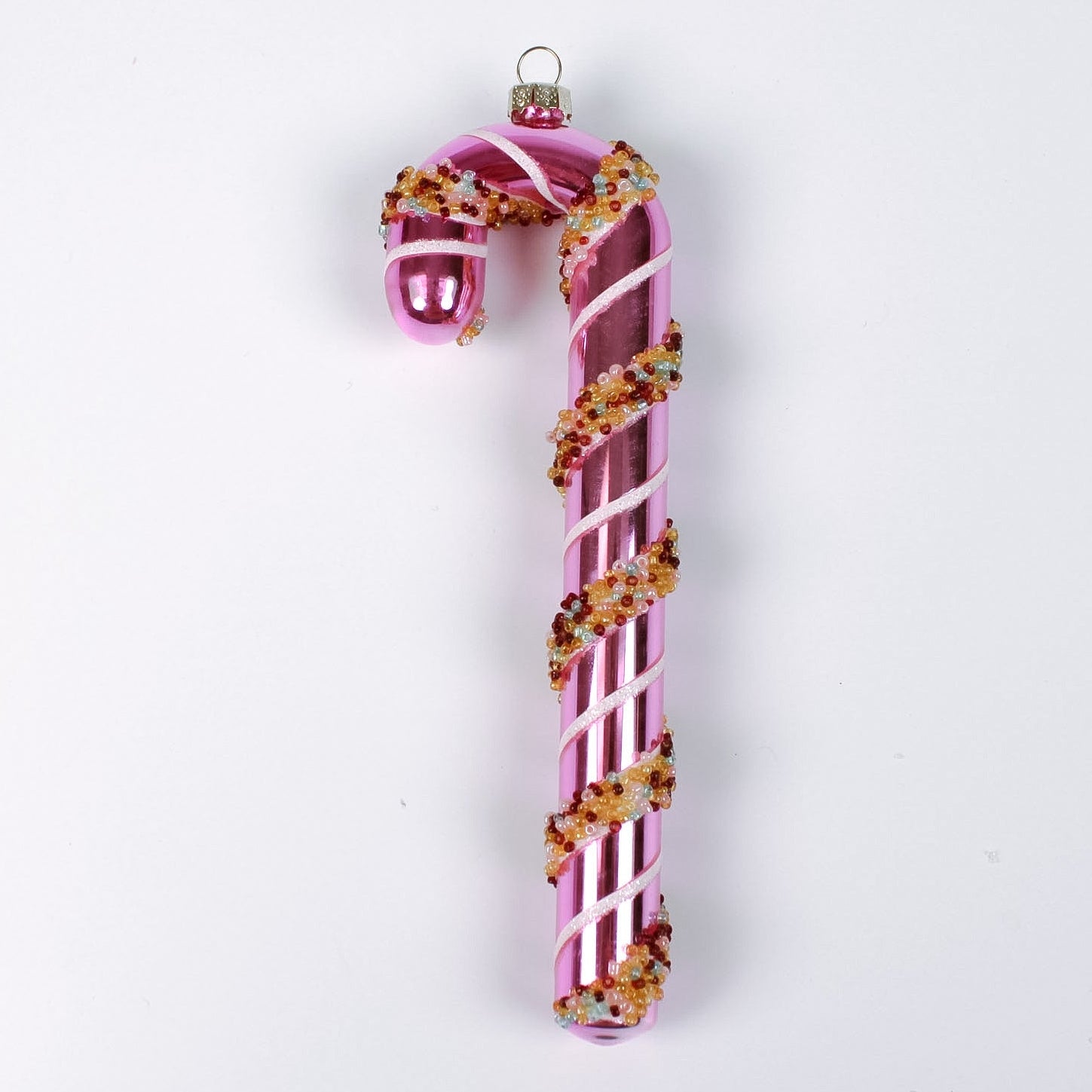 pink glass candy cane ornaments on a white background