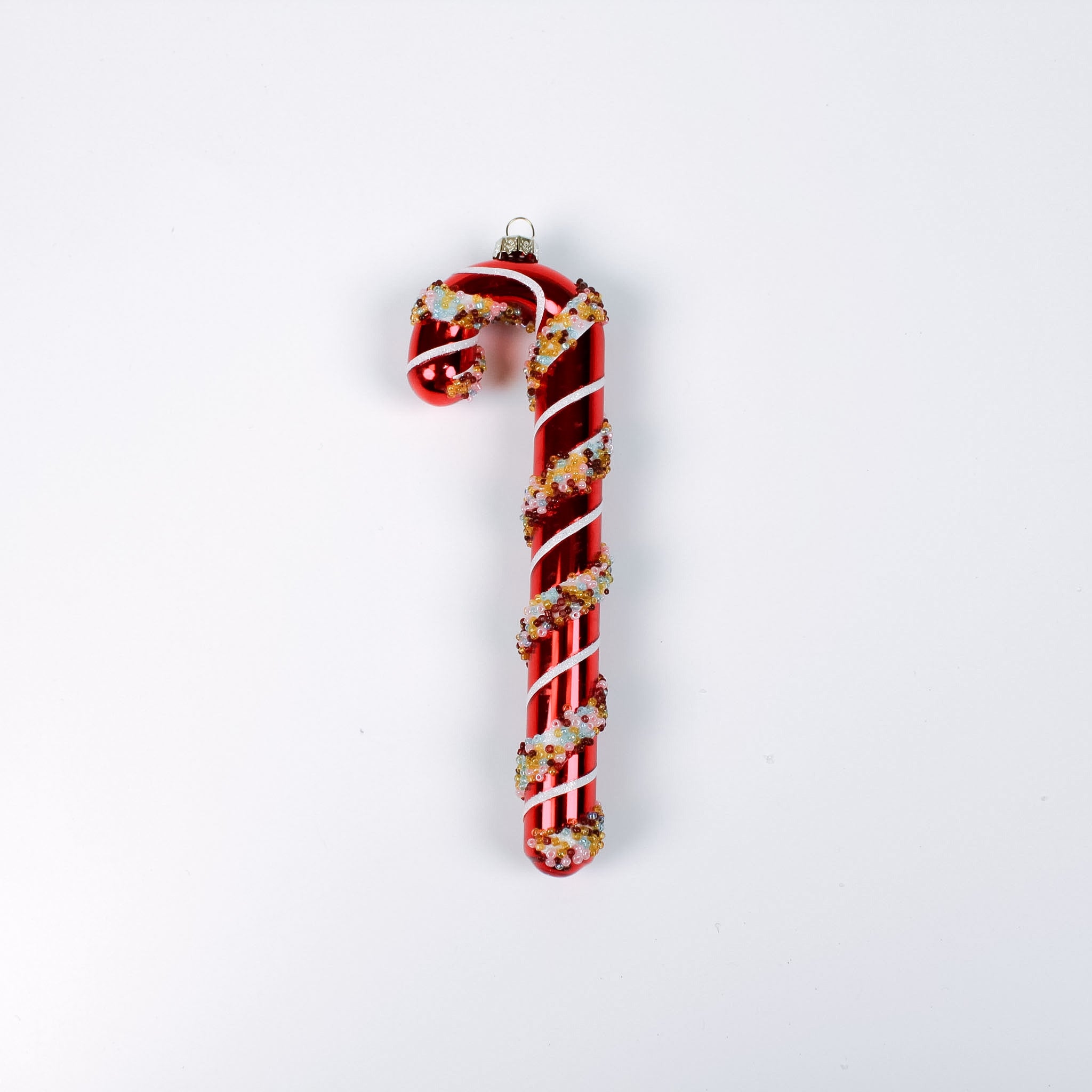 red glass candy cane ornaments on a white background