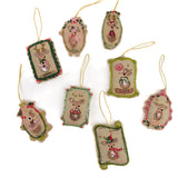 Set of decorative Christmas ornaments with reindeer designs on a white background