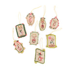 Set of decorative Christmas ornaments with reindeer designs on a white background