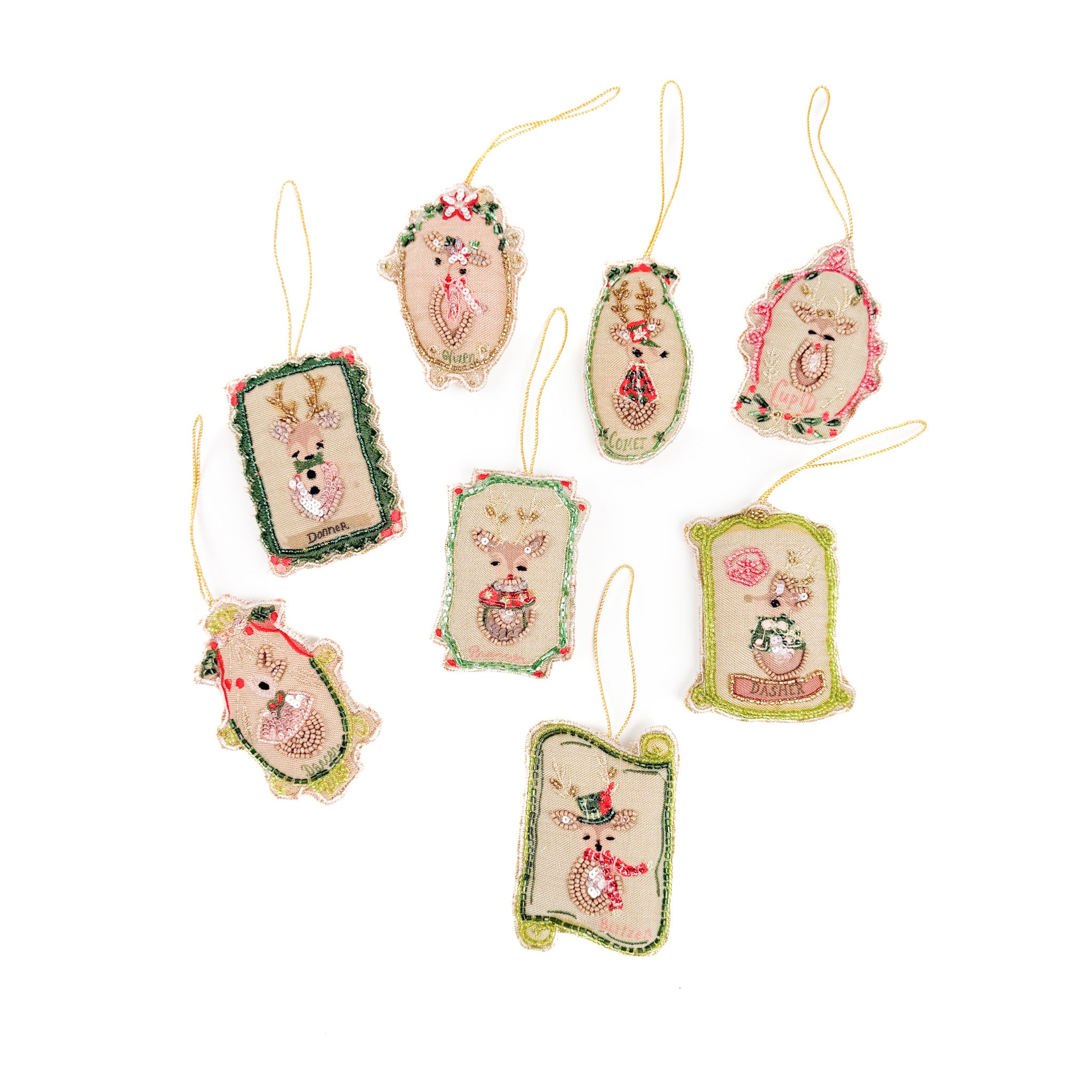 Set of decorative Christmas ornaments with reindeer designs on a white background