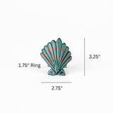 Blue and pink shell napkin ring measuring 2.75 inches wide and 3.25 inches high with 1.75 inch ring.