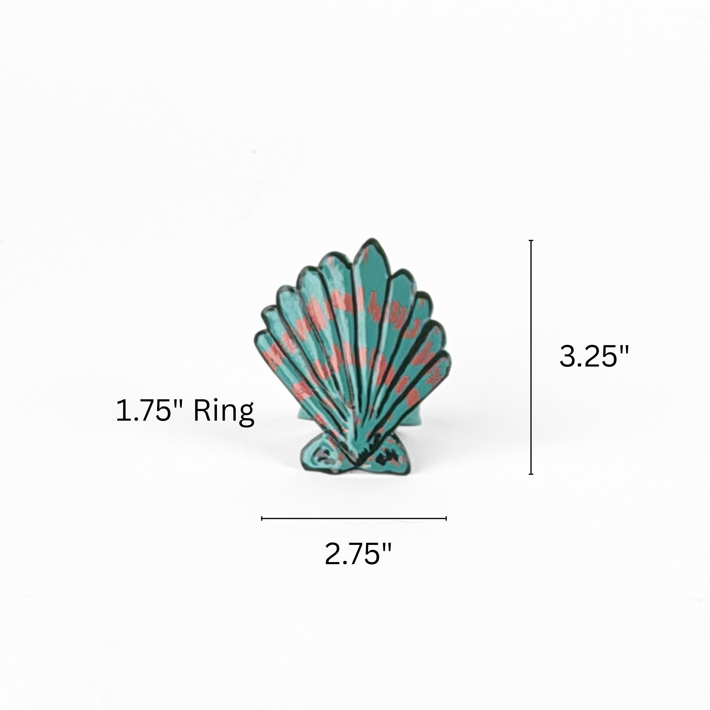 Blue and pink shell napkin ring measuring 2.75 inches wide and 3.25 inches high with 1.75 inch ring.