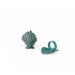 Pair of blue and pink shell napkin rings featuring coastal-inspired seashell design.