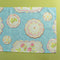 Society Hill Vintage Plates cloth table runner close-up in blue on a green background