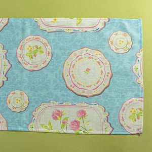Society Hill Vintage Plates cloth table runner close-up in blue on a green background