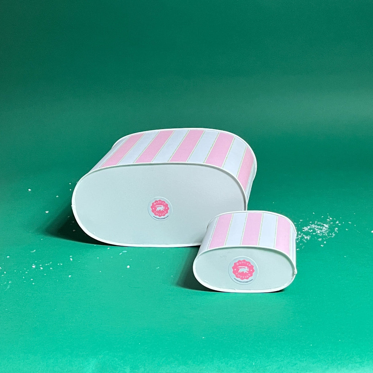 Bottom view of Cabana Boy caddies in large and small on a green bakground