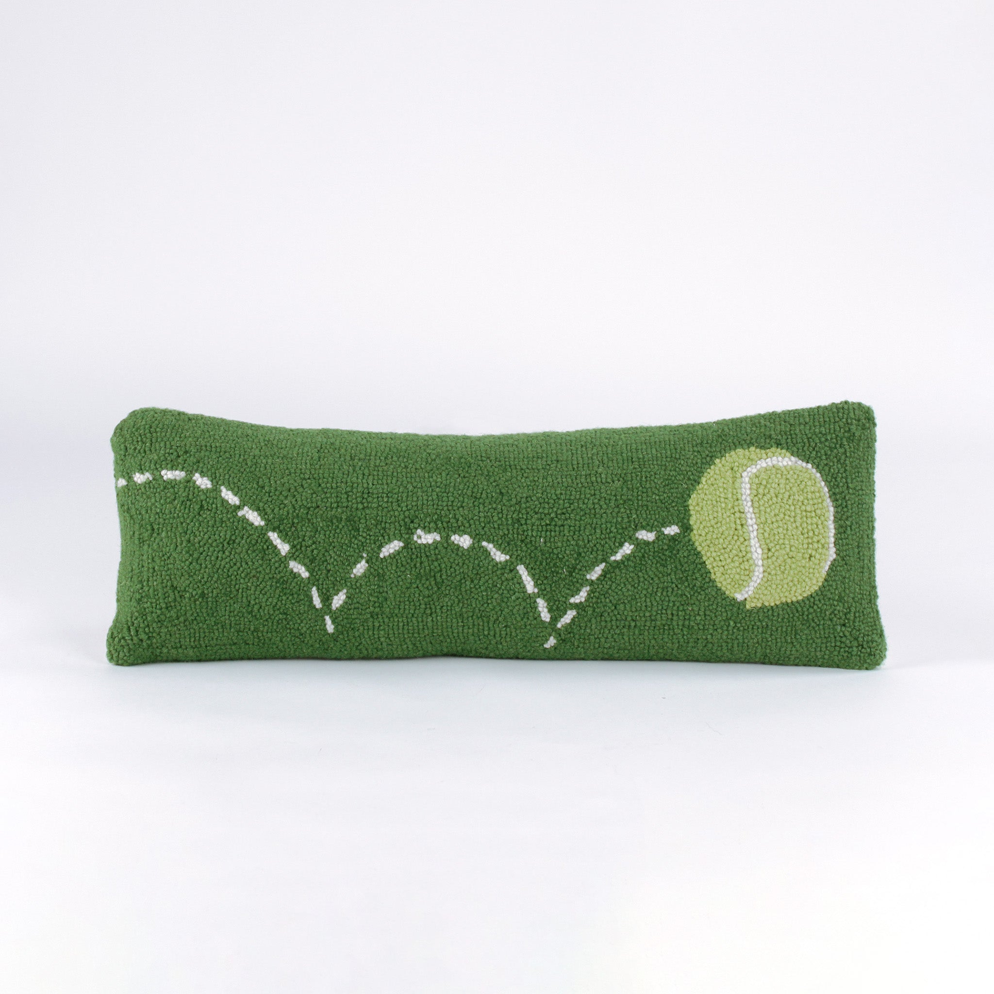 Rectangular green decorative pillow with a hooked texture, featuring a yellow tennis ball and a white dashed line illustrating its bounce pattern.