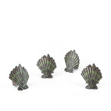 Brown and green shell napkin rings featuring coastal-inspired seashell designs.