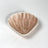 A small brown ceramic shell bowl