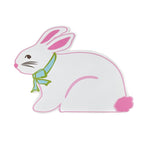 A white easter bunny placemat with pink ears, nose an tail with a green ribbon tied around its neck against a white background. 