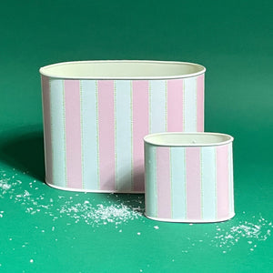 Empty duo of Cabana Boy caddies in large and small on a green bakground