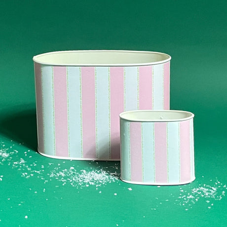 Empty duo of Cabana Boy caddies in large and small on a green bakground