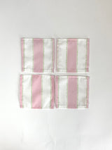 A set of four Cabana Boy white and pink stripe cloth cocktail napkins in a linen-like poly