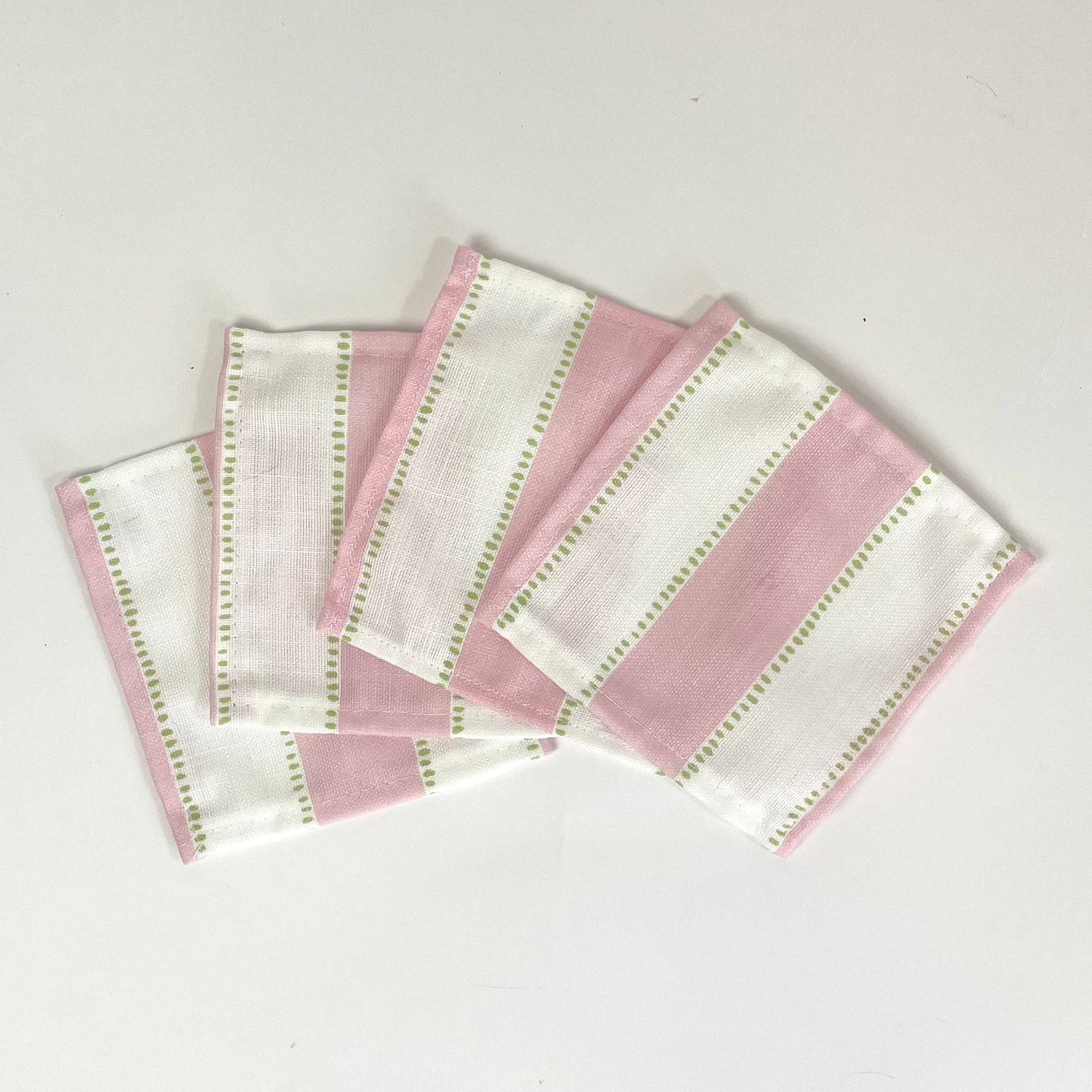 A set of four Cabana Boy white and pink stripe cloth cocktail napkins from madcap cottage