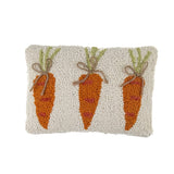 front hooked pillow with orange carrot design on neutral textured background
