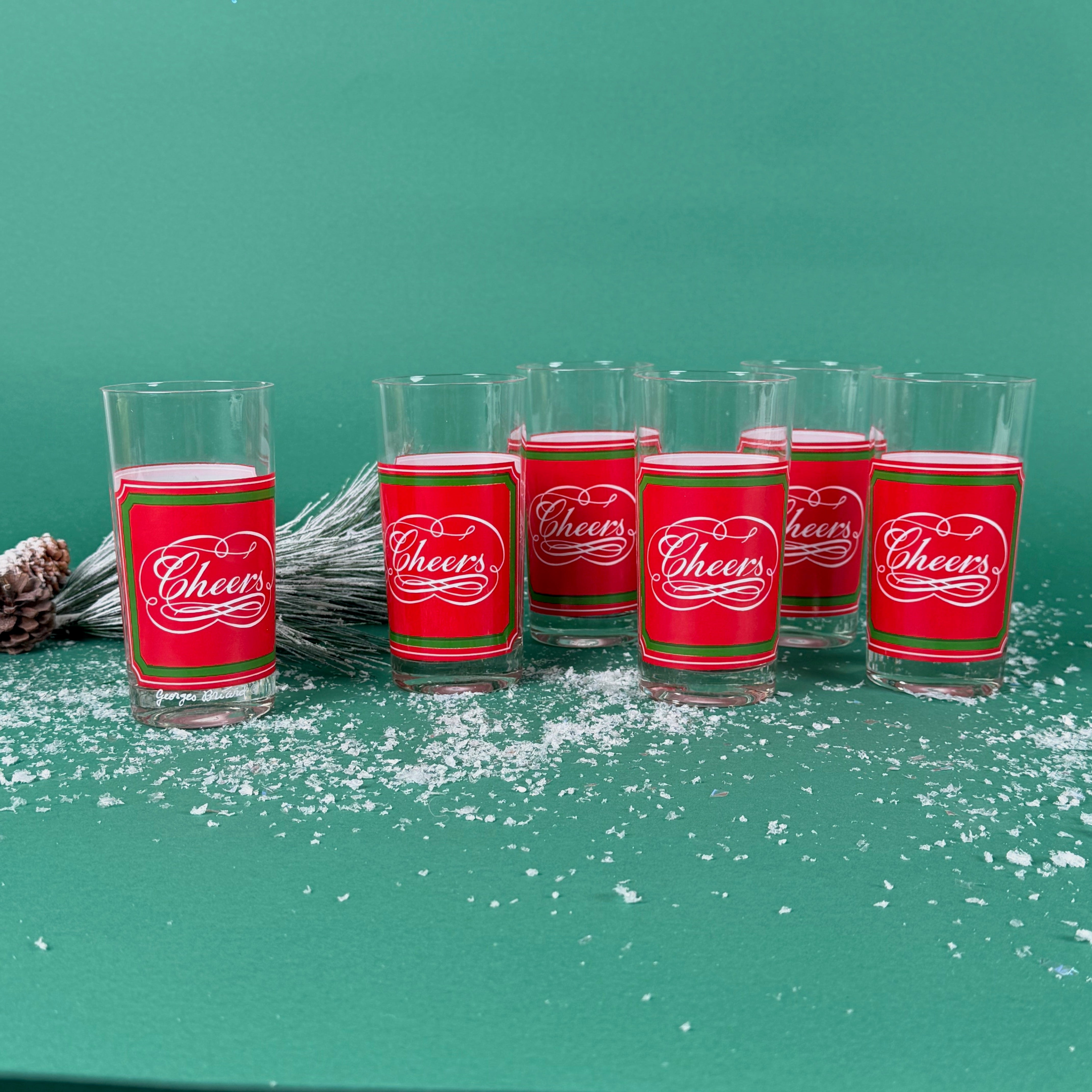 set of 6 Vintage Cheers Calligraphy Tall Red and Green Drinks Glasses on a green background