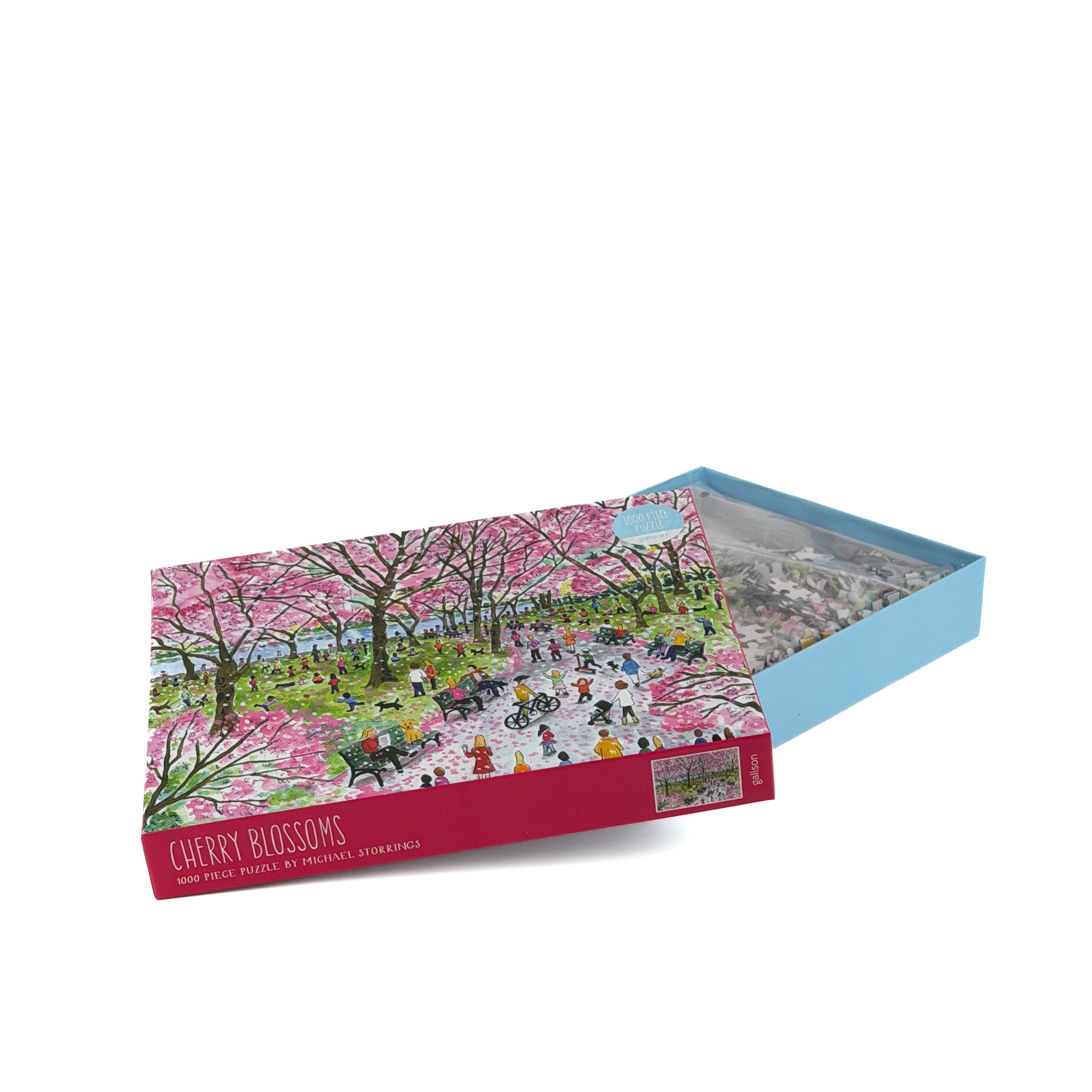 Opened 1000 piece jigsaw puzzle with cherry blossoms artwork in decorative box