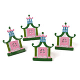 four pink and green pagoda shaped metal chinoiserie napkin rings from madcap cottage. 