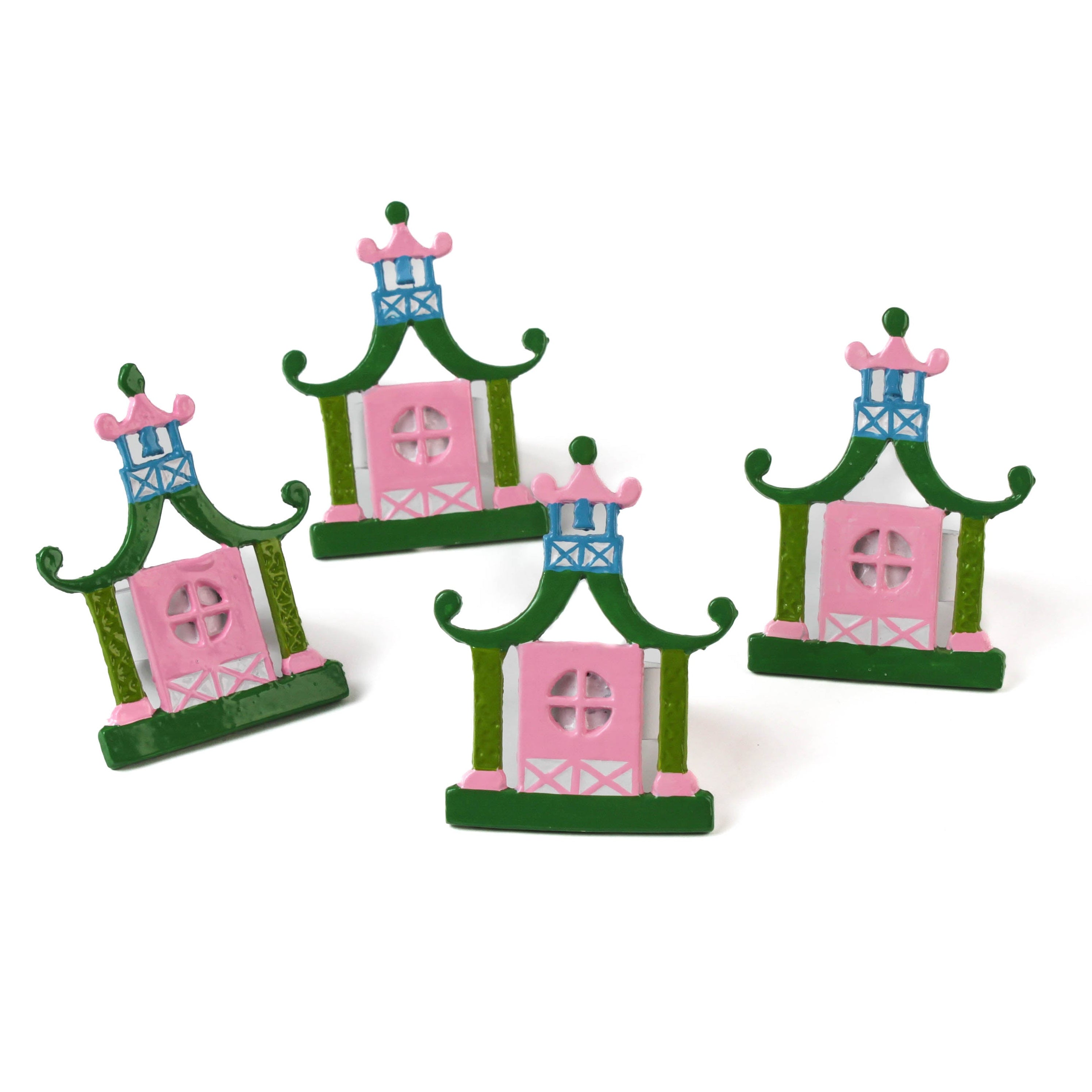 four pink and green pagoda shaped metal chinoiserie napkin rings from madcap cottage. 