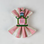 Chinoiserie Pagoda Painted-Metal Napkin Rings with one on a pink and white dinner napkin
