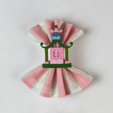 Chinoiserie Pagoda Painted-Metal Napkin Rings with one on a pink and white dinner napkin