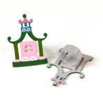 two pink and green pagoda shaped metal chinoiserie napkin rings from madcap cottage. 