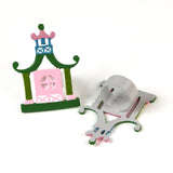 two pink and green pagoda shaped metal chinoiserie napkin rings from madcap cottage. 