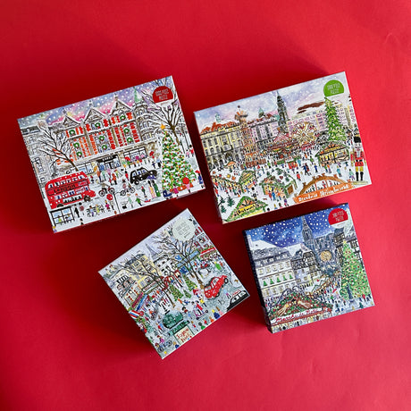 Four jigsaw puzzles depicting Christmas scenes in different European cities, each with distinctive holiday decorations and imagery.