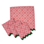 red lattice-pattern dinner napkin set with green scalloped edges