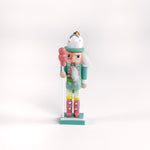 Colorful pastel nutcracker ornaments with candy accents