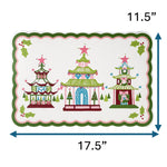 Rectangular Christmas decorative placemat featuring three colorful pagoda illustrations with star toppers, holly accents, and a scalloped green and pink border, measuring approximately 17.5 inches wide and 11.5 inches tall, displayed on a white background.