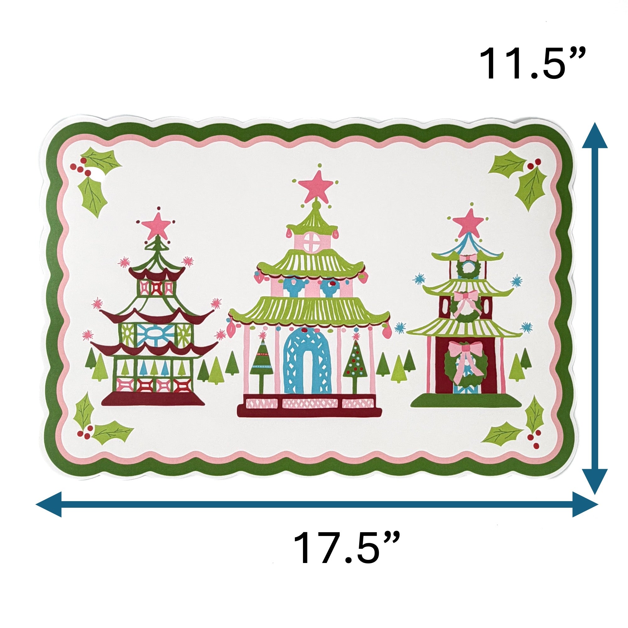 Rectangular Christmas decorative placemat featuring three colorful pagoda illustrations with star toppers, holly accents, and a scalloped green and pink border, measuring approximately 17.5 inches wide and 11.5 inches tall, displayed on a white background.