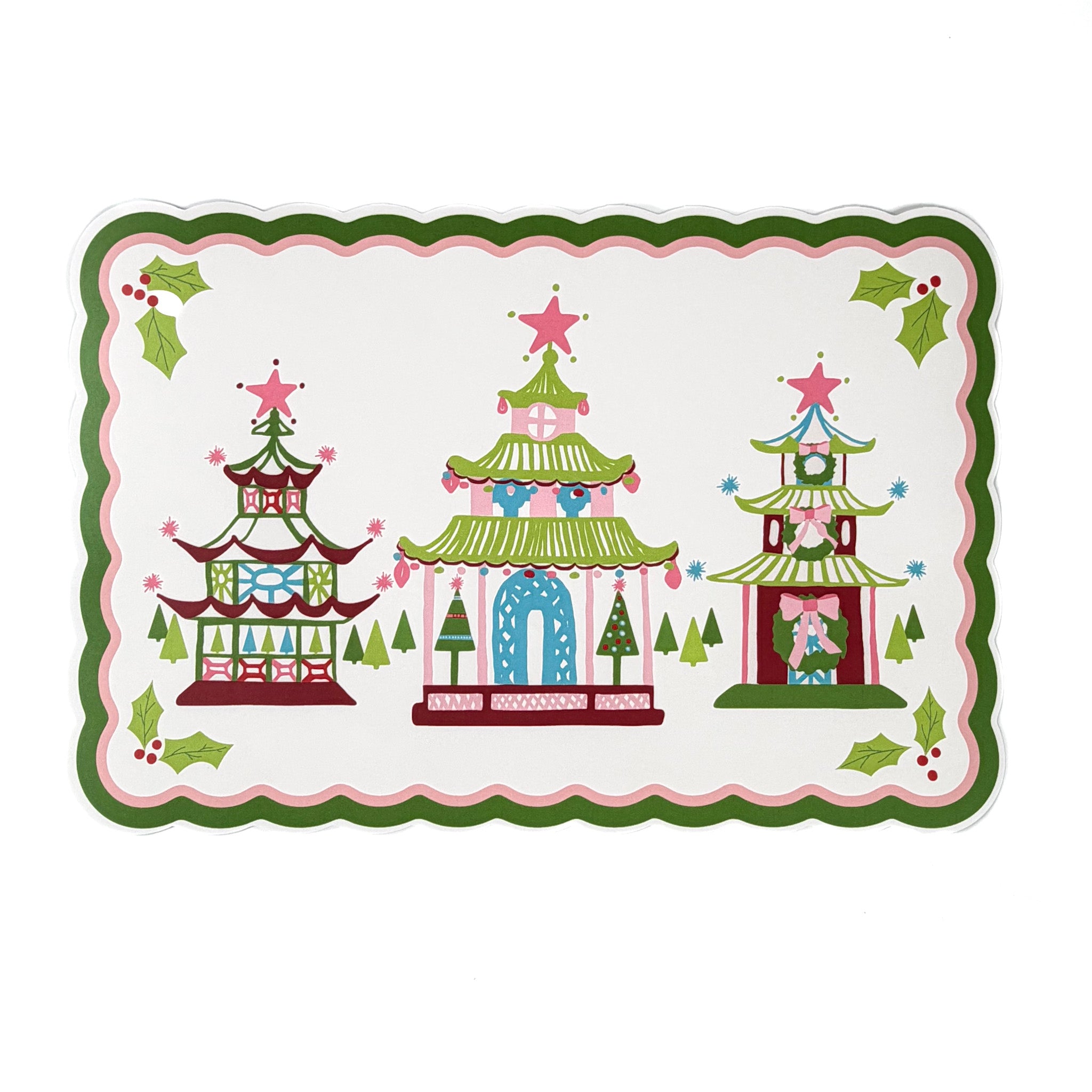 Decorative Christmas placemat featuring three colorful pagoda illustrations with star toppers, holly accents, and scalloped green and pink border, displayed on a white background.