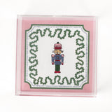 medium Nutcracker Square Acrylic Tray with pink and green border and Nutcracker in the center.