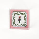 small Nutcracker Square Acrylic Tray with pink and green border and Nutcracker in the center.