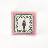 small Nutcracker Square Acrylic Tray with pink and green border and Nutcracker in the center.