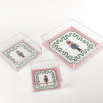 Nutcracker Square Acrylic Tray with in 3 sizes with pink and green border and Nutcracker in the center.