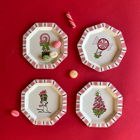 A set of four hand painted tole metal trinket trays featuring Christmas Treats.