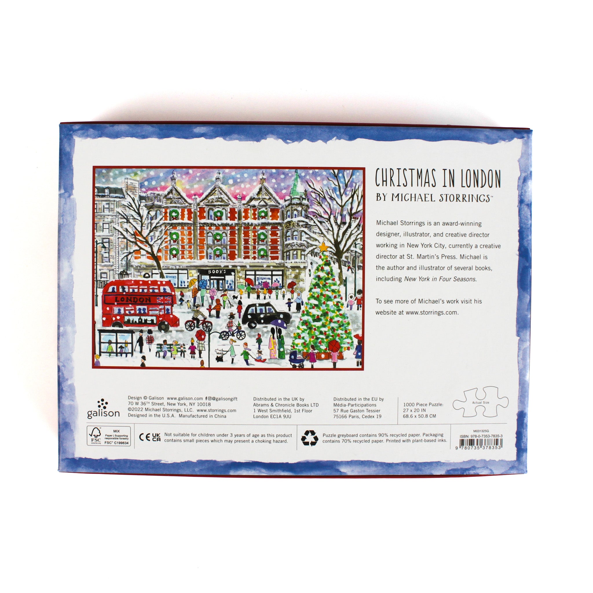 Christmas in London 1000-piece jigsaw puzzle by Michael Storrings, illustrated holiday street scene featuring festive decorations, Christmas tree, double-decker bus, and snowy London cityscape — puzzle box back with artwork description.