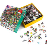 Christmas in New Orleans 1000-piece puzzle by Michael Storrings shown with the box open and colorful jigsaw pieces scattered on a white surface.